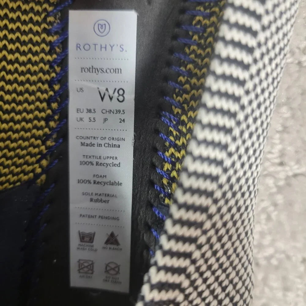 Rothy's Black & White Knit Flats with Blue and Yellow Trim